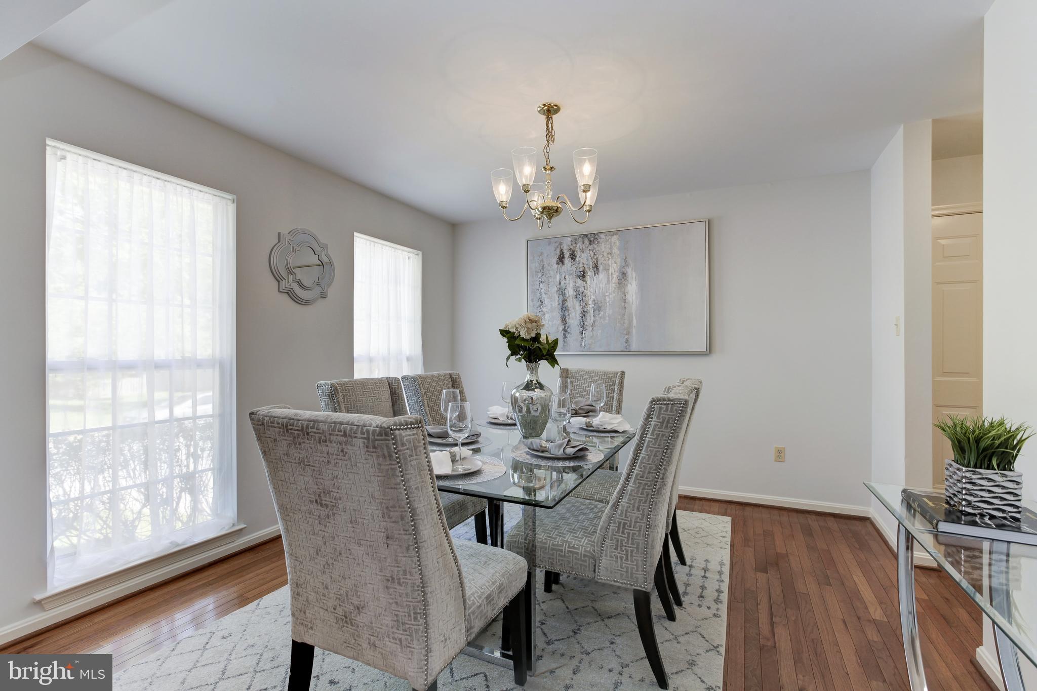 8014 Big Pool Road Laurel, MD 20724 - Photo 21 of 52 a view of a dining room with furniture window and wooden floor