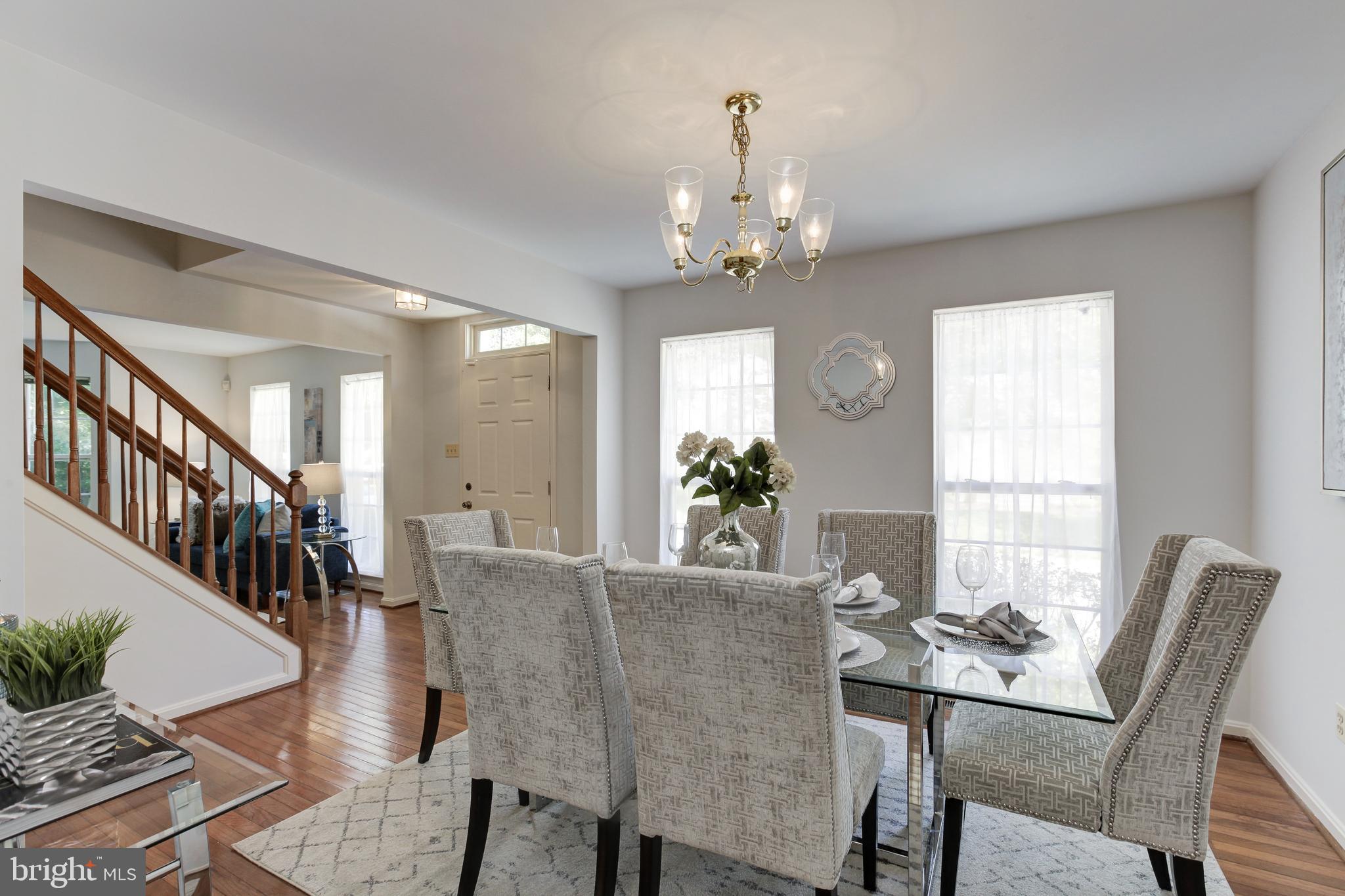 8014 Big Pool Road Laurel, MD 20724 - Photo 23 of 52 a view of a dining room with furniture window and wooden floor
