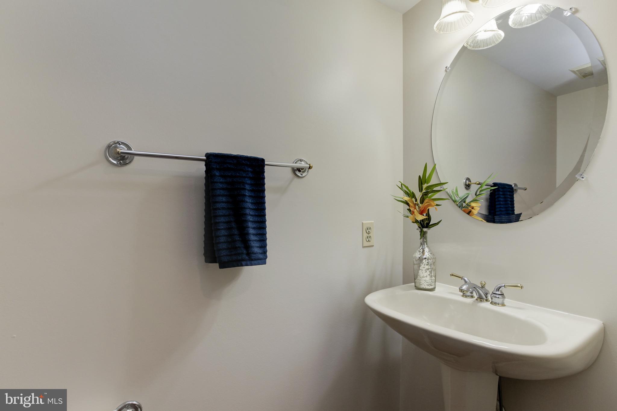 8014 Big Pool Road Laurel, MD 20724 - Photo 24 of 52 a bathroom with a sink and a mirror