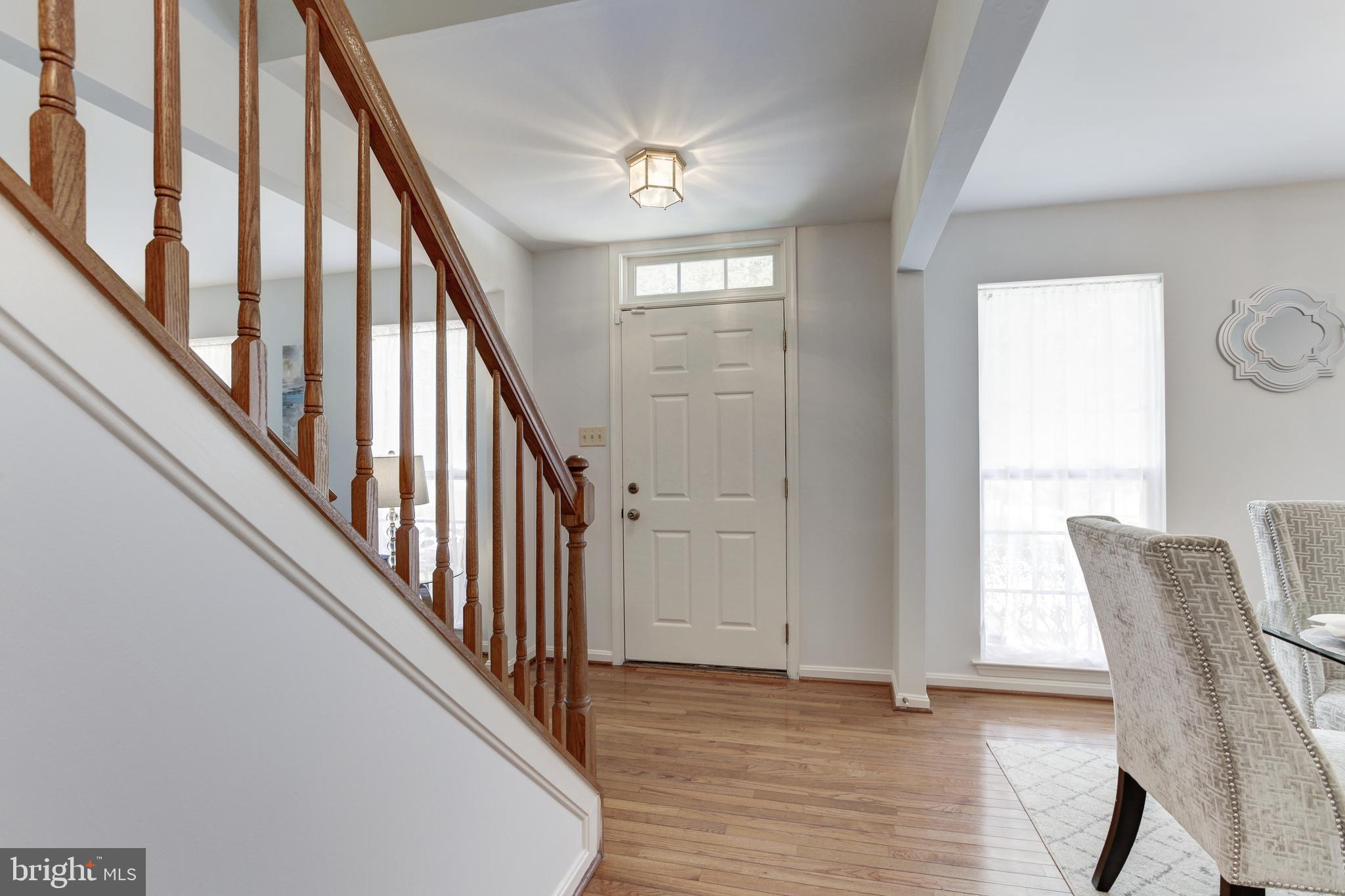 8014 Big Pool Road Laurel, MD 20724 - Photo 25 of 52 a view of staircase with wooden floor and fan