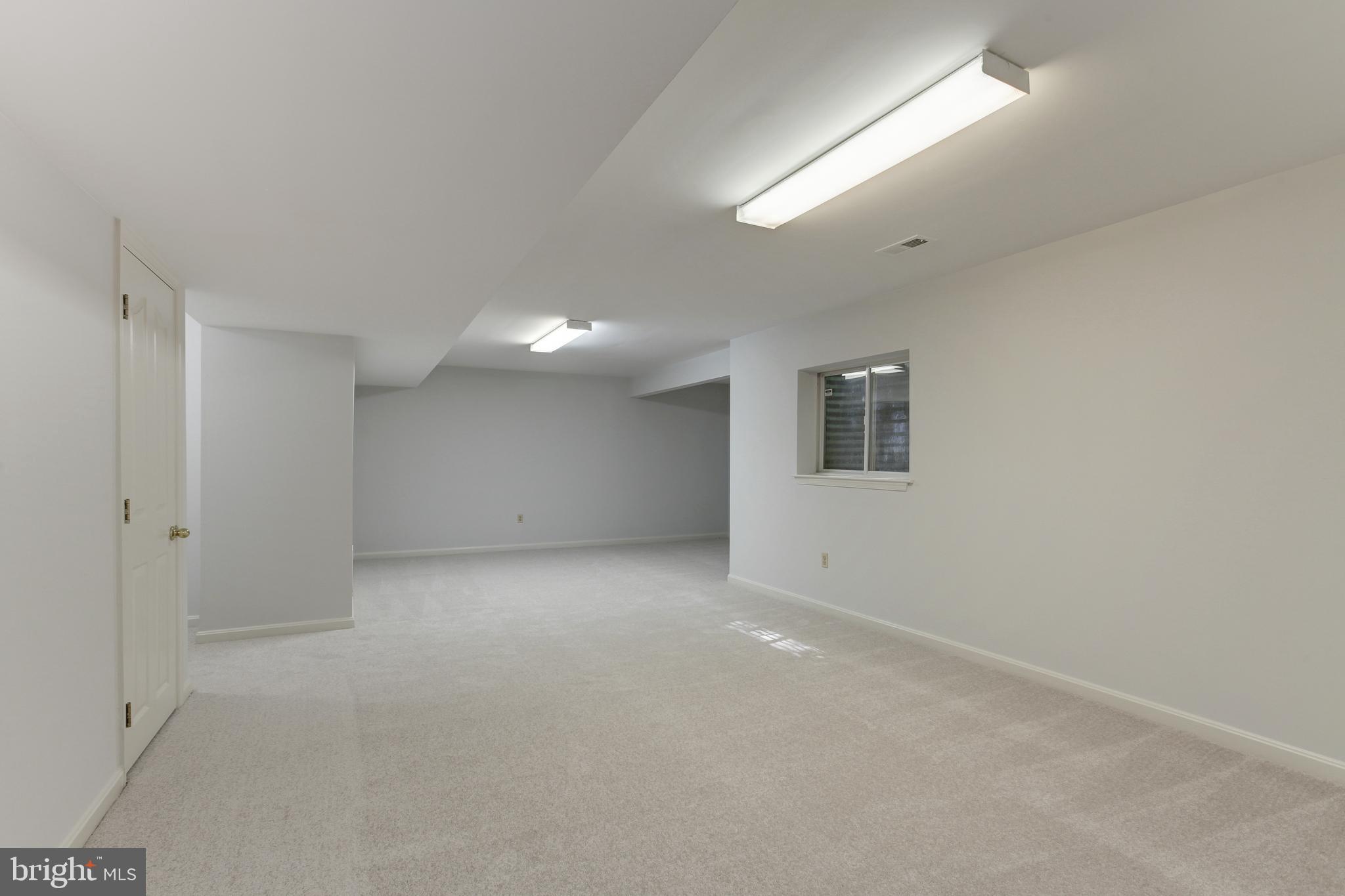 8014 Big Pool Road Laurel, MD 20724 - Photo 39 of 52 en empty room with windows