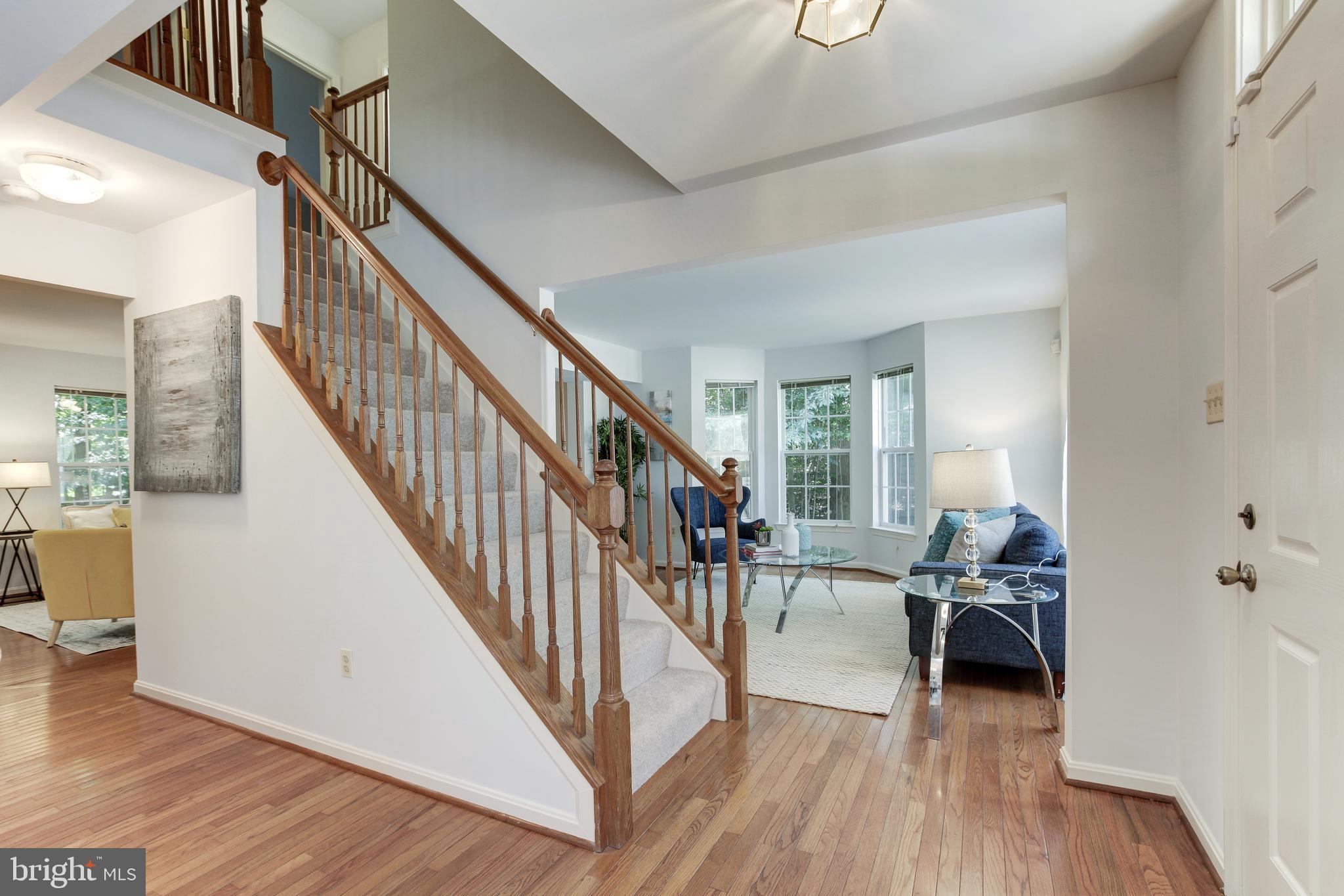8014 Big Pool Road Laurel, MD 20724 - Photo 5 of 52 a view of a livingroom with furniture and hardwood floor