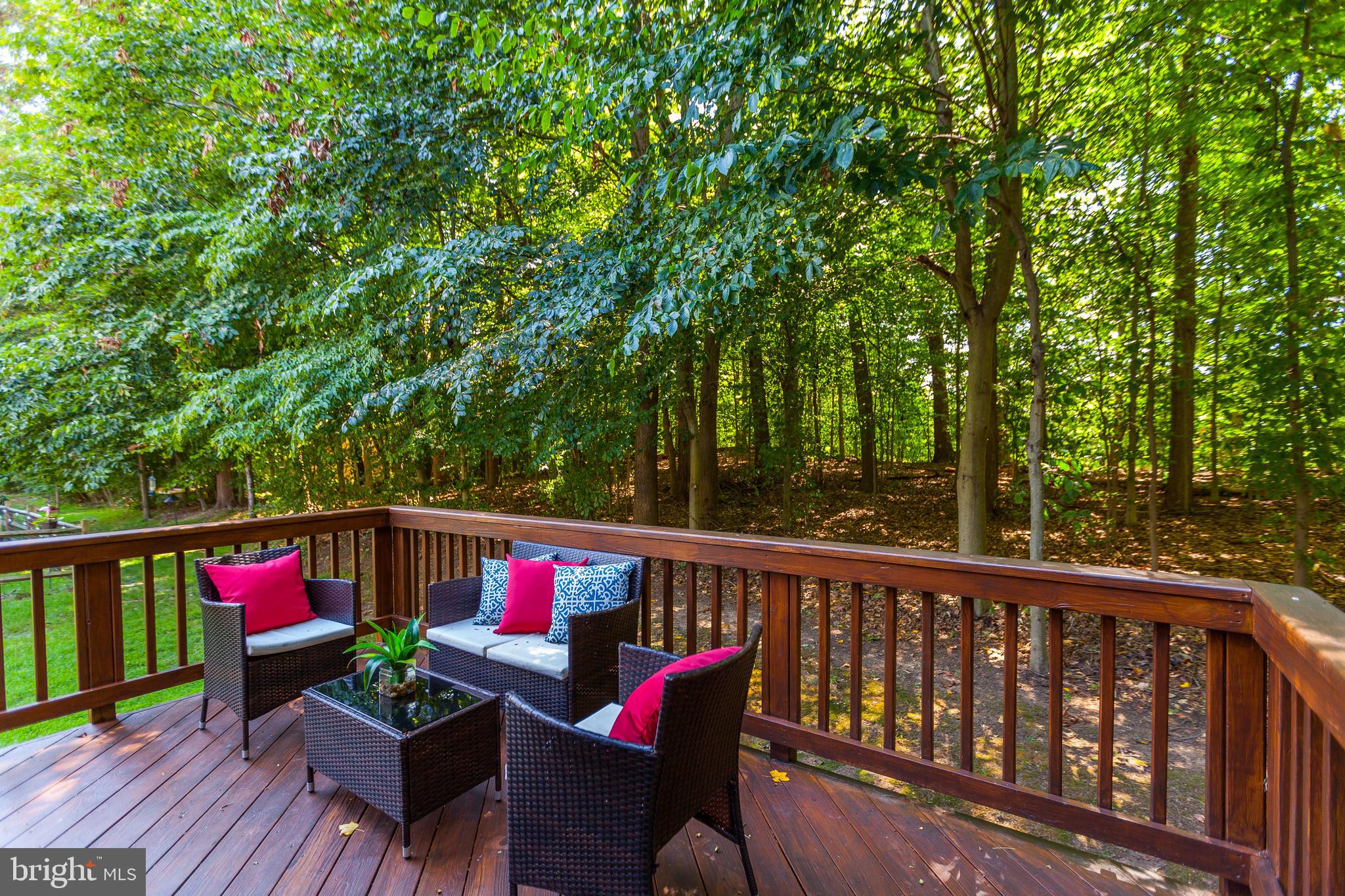 8014 Big Pool Road Laurel, MD 20724 - Photo 47 of 52 a view of deck with wooden floor and outdoor seating
