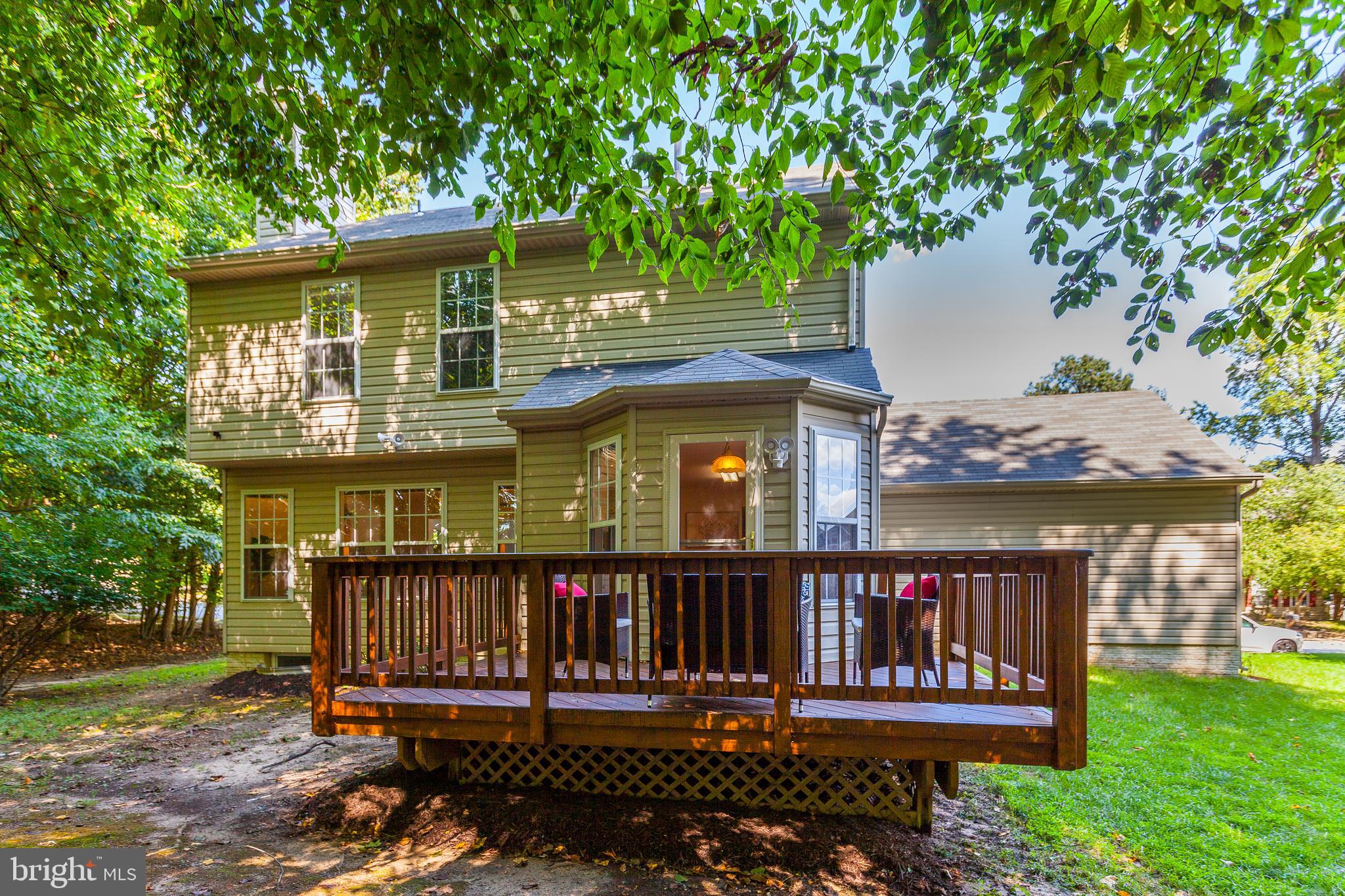 8014 Big Pool Road Laurel, MD 20724 - Photo 49 of 52 a view of a house with wooden deck and a yard