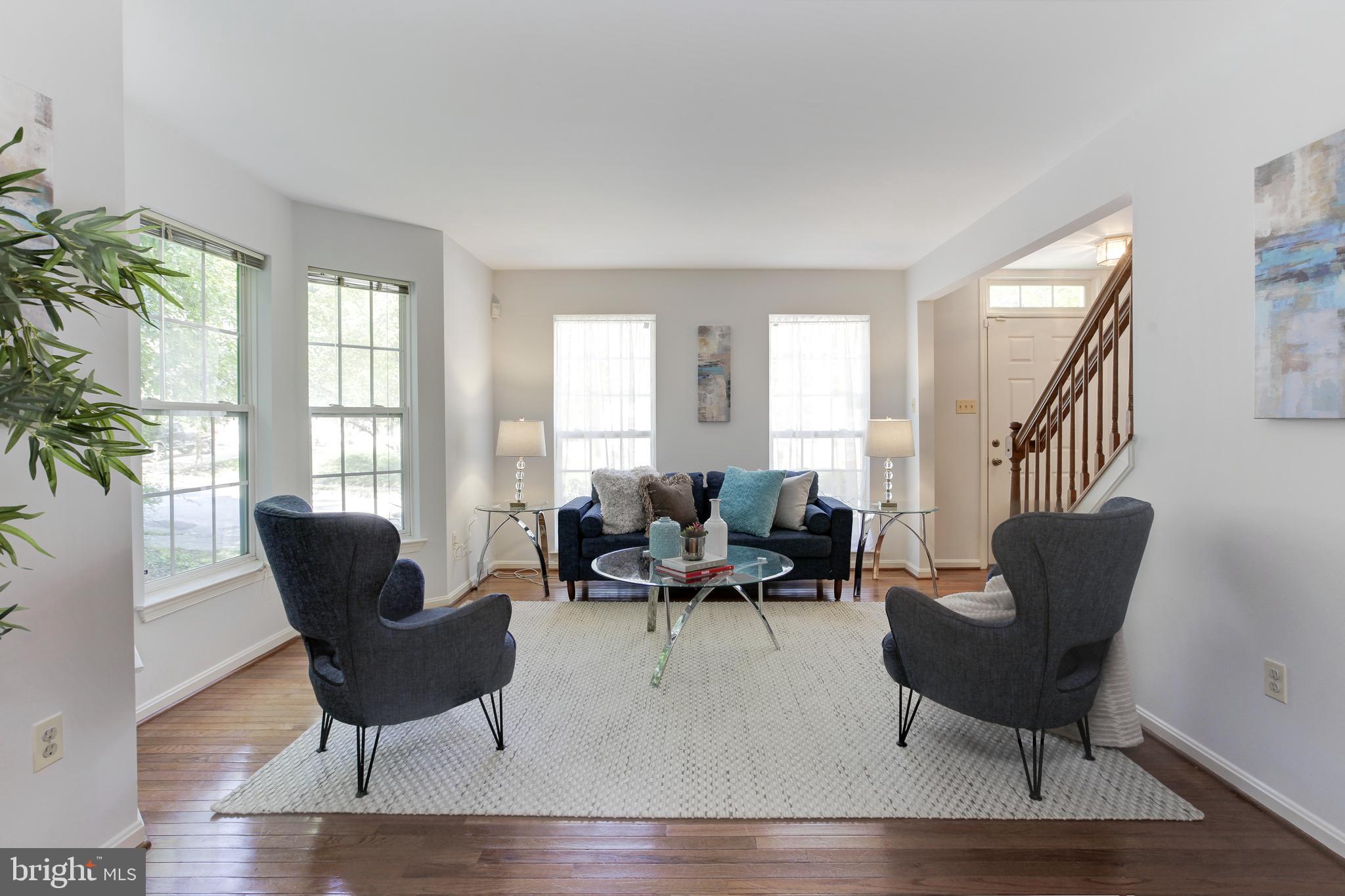 8014 Big Pool Road Laurel, MD 20724 - Photo 7 of 52 a living room with furniture and a potted plant