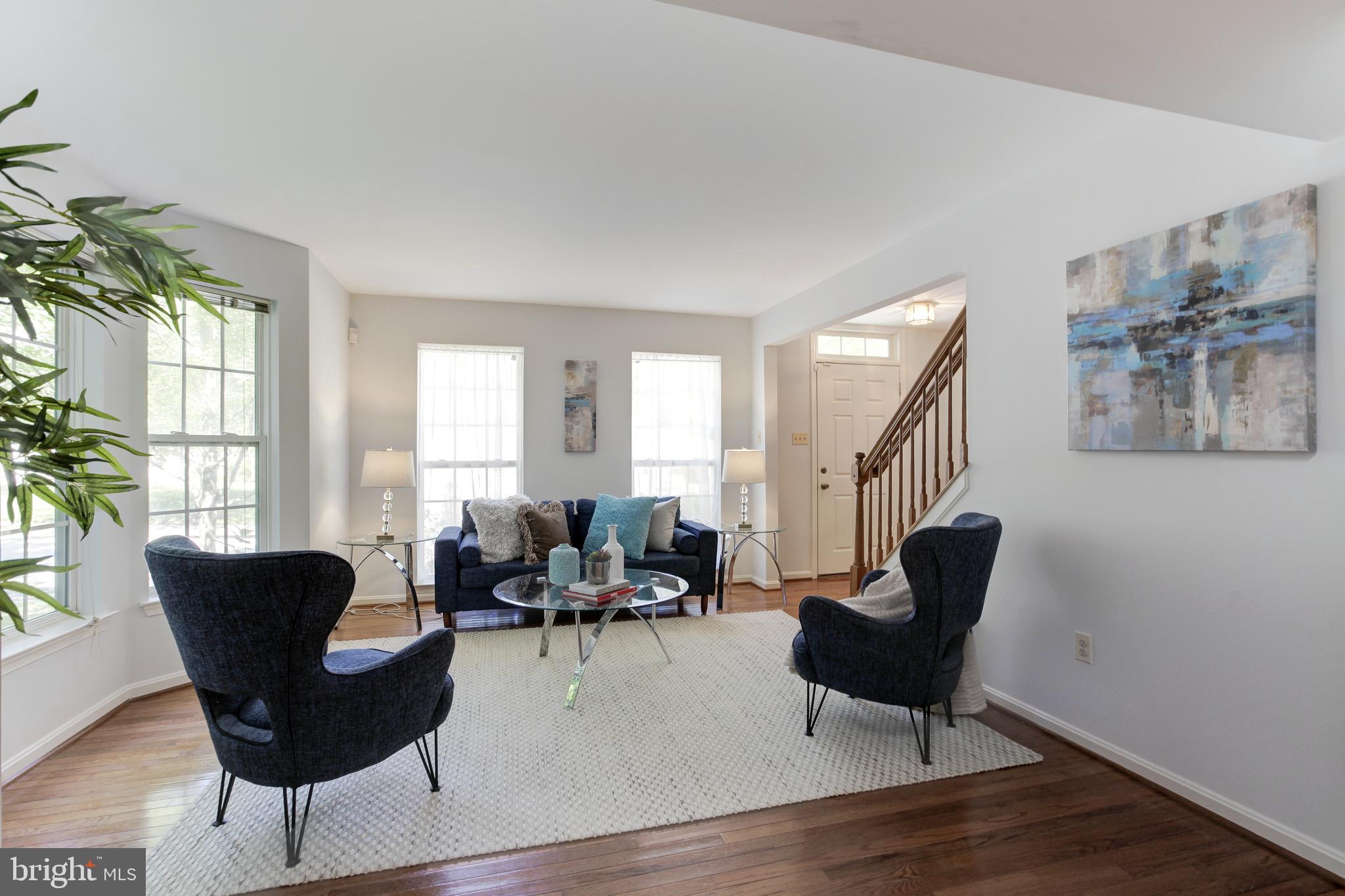 8014 Big Pool Road Laurel, MD 20724 - Photo 8 of 52 a living room with furniture and a wooden floor