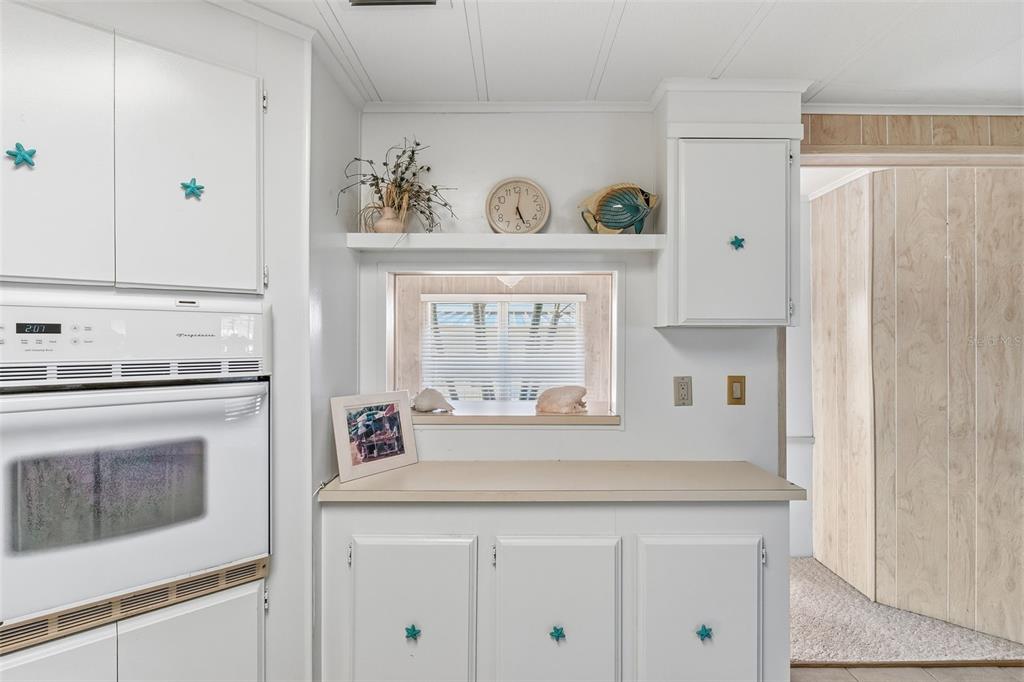 119 Lazy River Road North Port, FL 34287 - Photo 22 of 76 a kitchen with a stove and a refrigerator