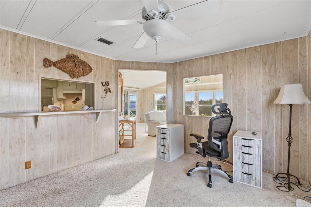 119 Lazy River Road North Port, FL 34287 - Photo 24 of 76 a view of a livingroom with workspace and a window