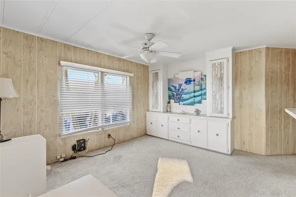 a bathroom with a double vanity sink a mirror and a bathtub
