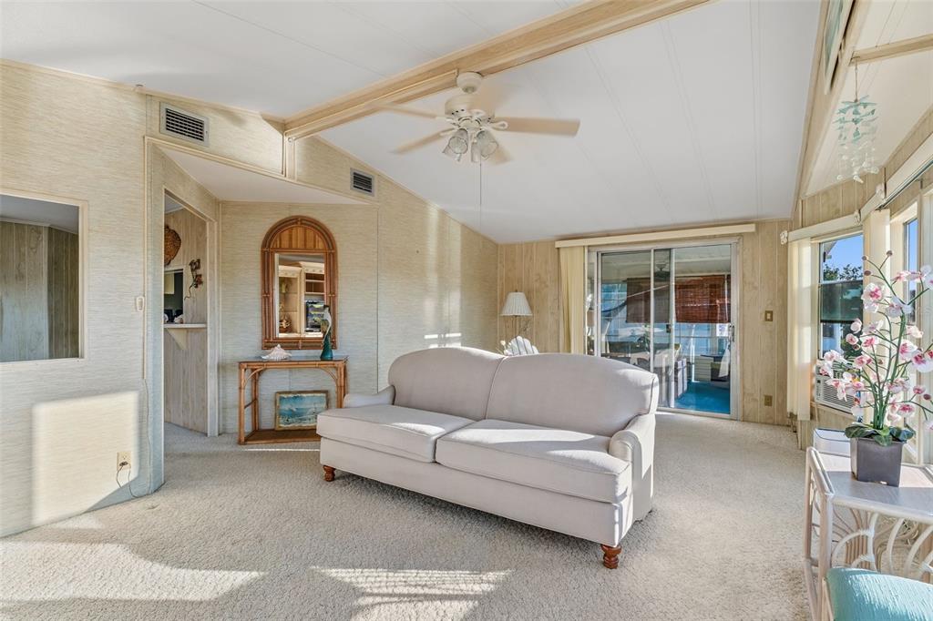 119 Lazy River Road North Port, FL 34287 - Photo 28 of 76 a living room with furniture and a chandelier