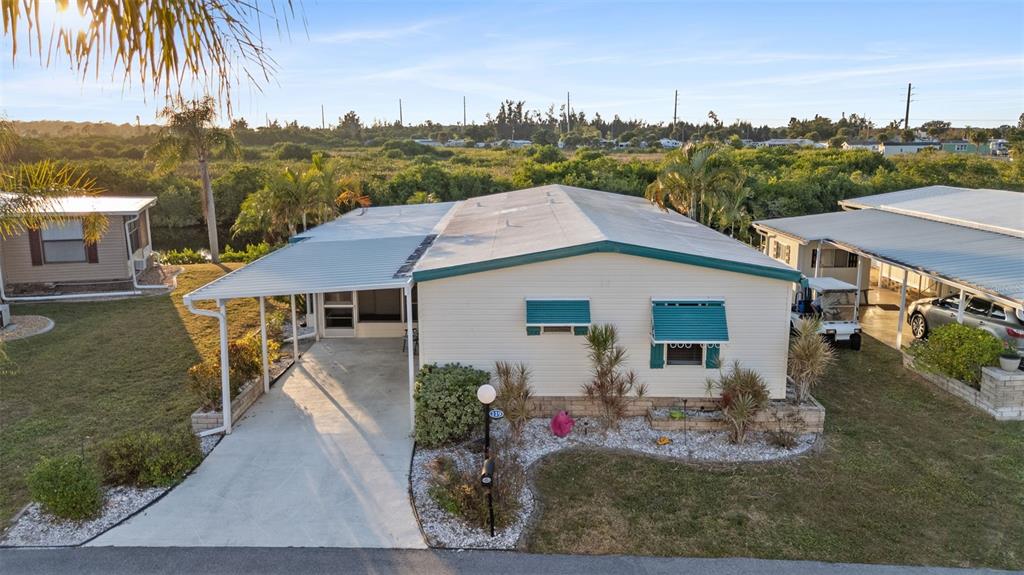 119 Lazy River Road North Port, FL 34287 - Photo 3 of 76 a house view with a garden space