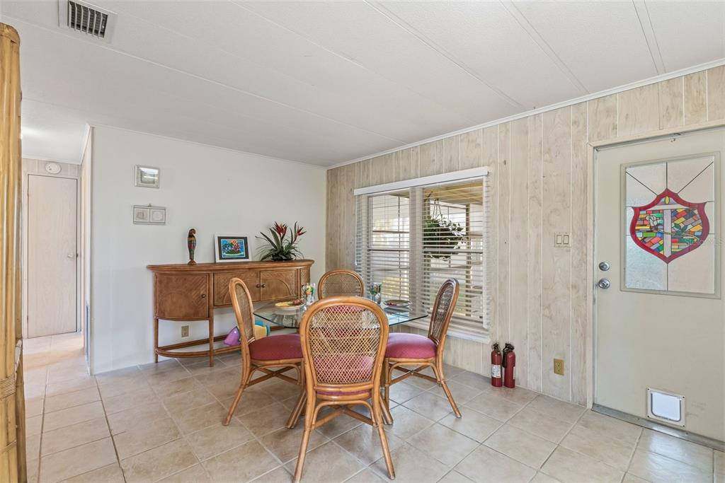 119 Lazy River Road North Port, FL 34287 - Photo 33 of 76 a dining room with furniture and window