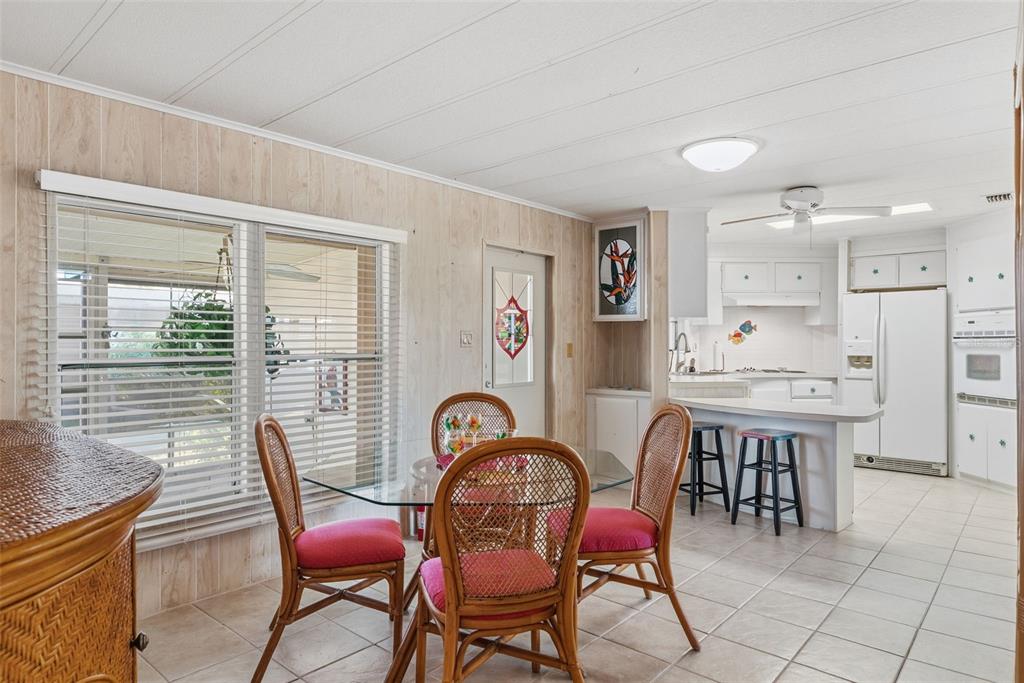 119 Lazy River Road North Port, FL 34287 - Photo 34 of 76 a dining room with furniture and window