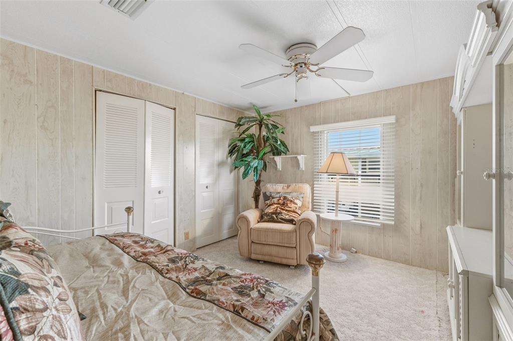 119 Lazy River Road North Port, FL 34287 - Photo 35 of 76 a bedroom with a bed and furniture