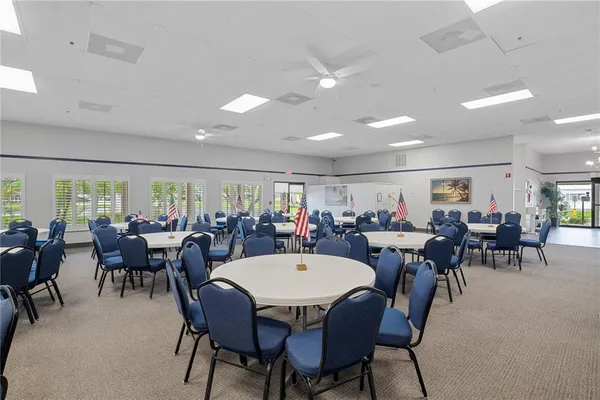 a view of a storage room with a table and chairs