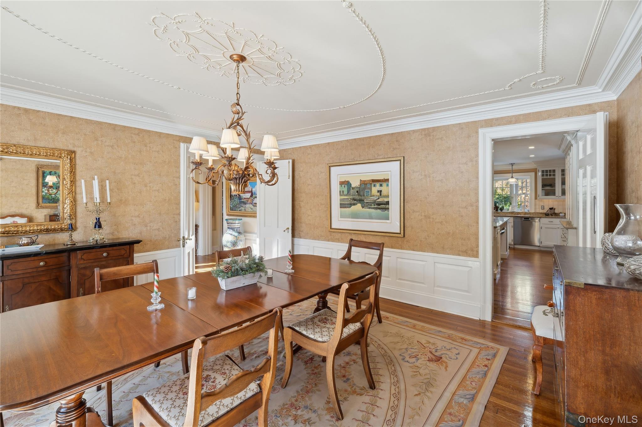 139 Hampshire Road Bronxville, NY 10708 - Photo 14 of 47 a dining room with furniture a chandelier and wooden floor