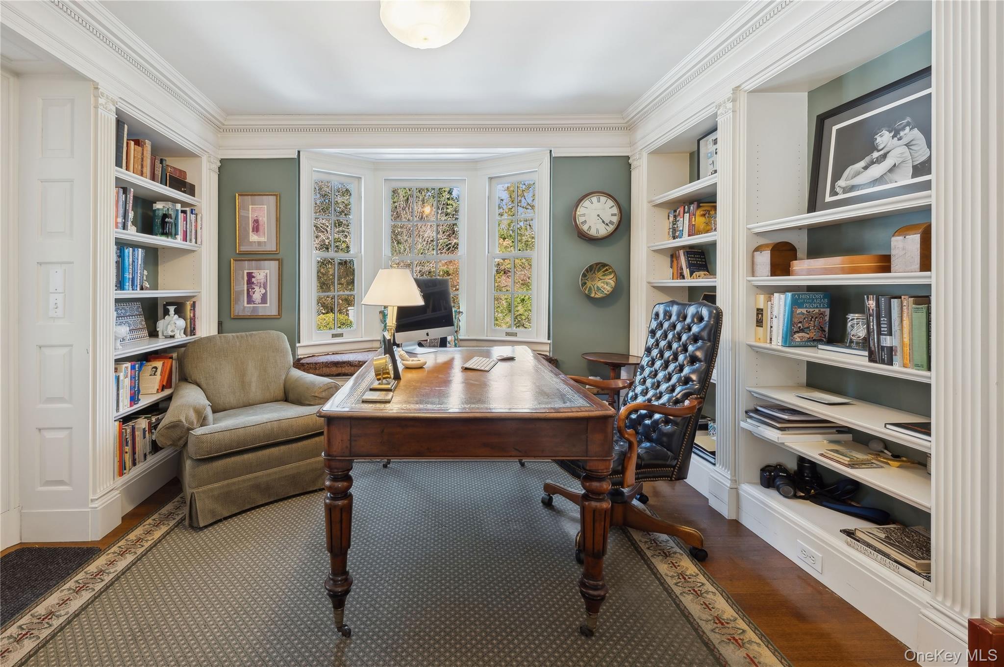 139 Hampshire Road Bronxville, NY 10708 - Photo 15 of 47 a living room with furniture a bookshelf and a window
