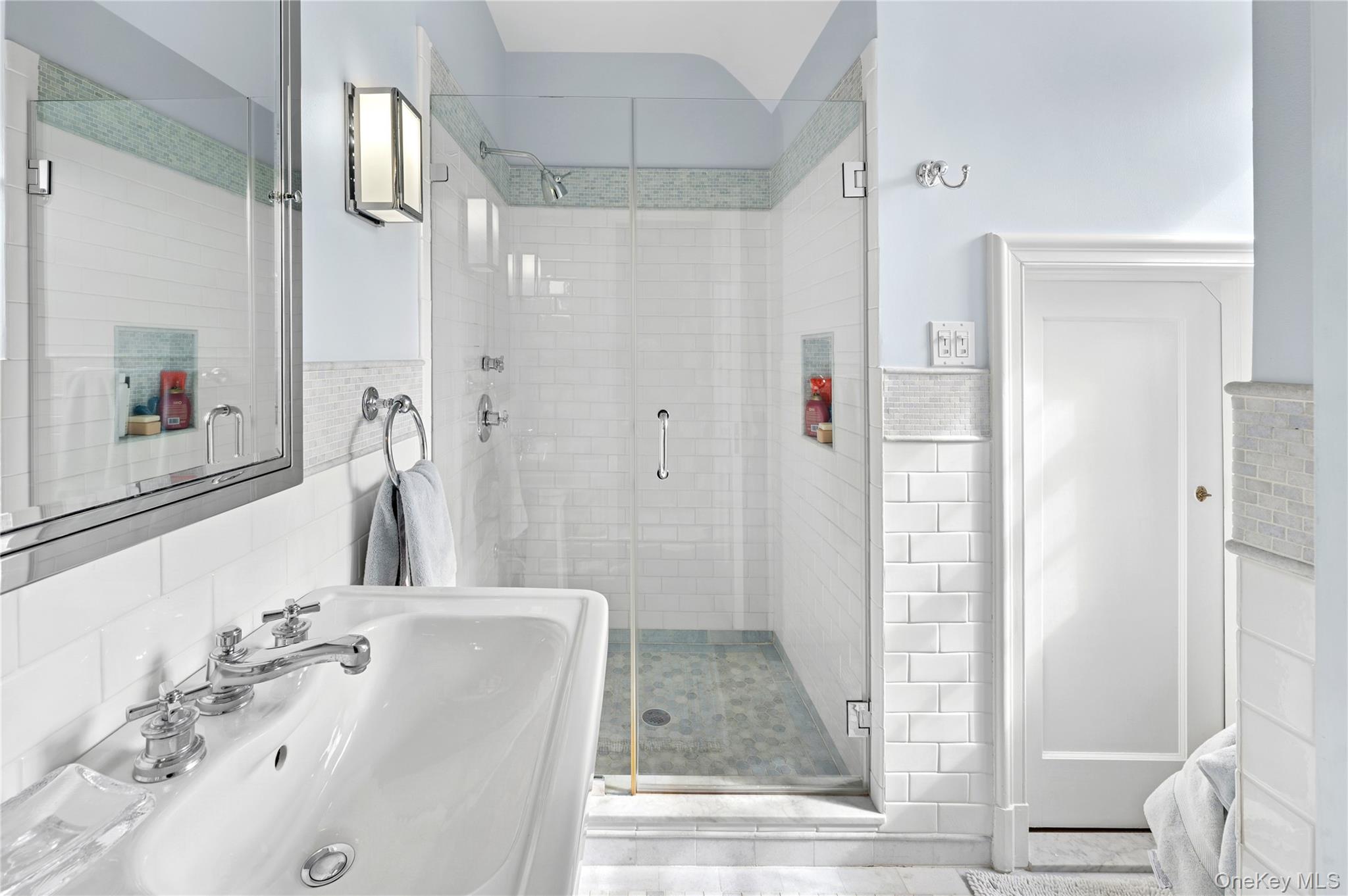139 Hampshire Road Bronxville, NY 10708 - Photo 34 of 47 a bathroom with a tub shower sink and mirror