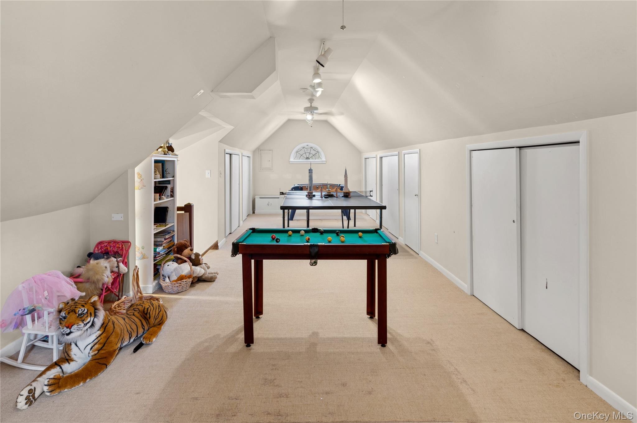 139 Hampshire Road Bronxville, NY 10708 - Photo 36 of 47 a living room with furniture and a chandelier