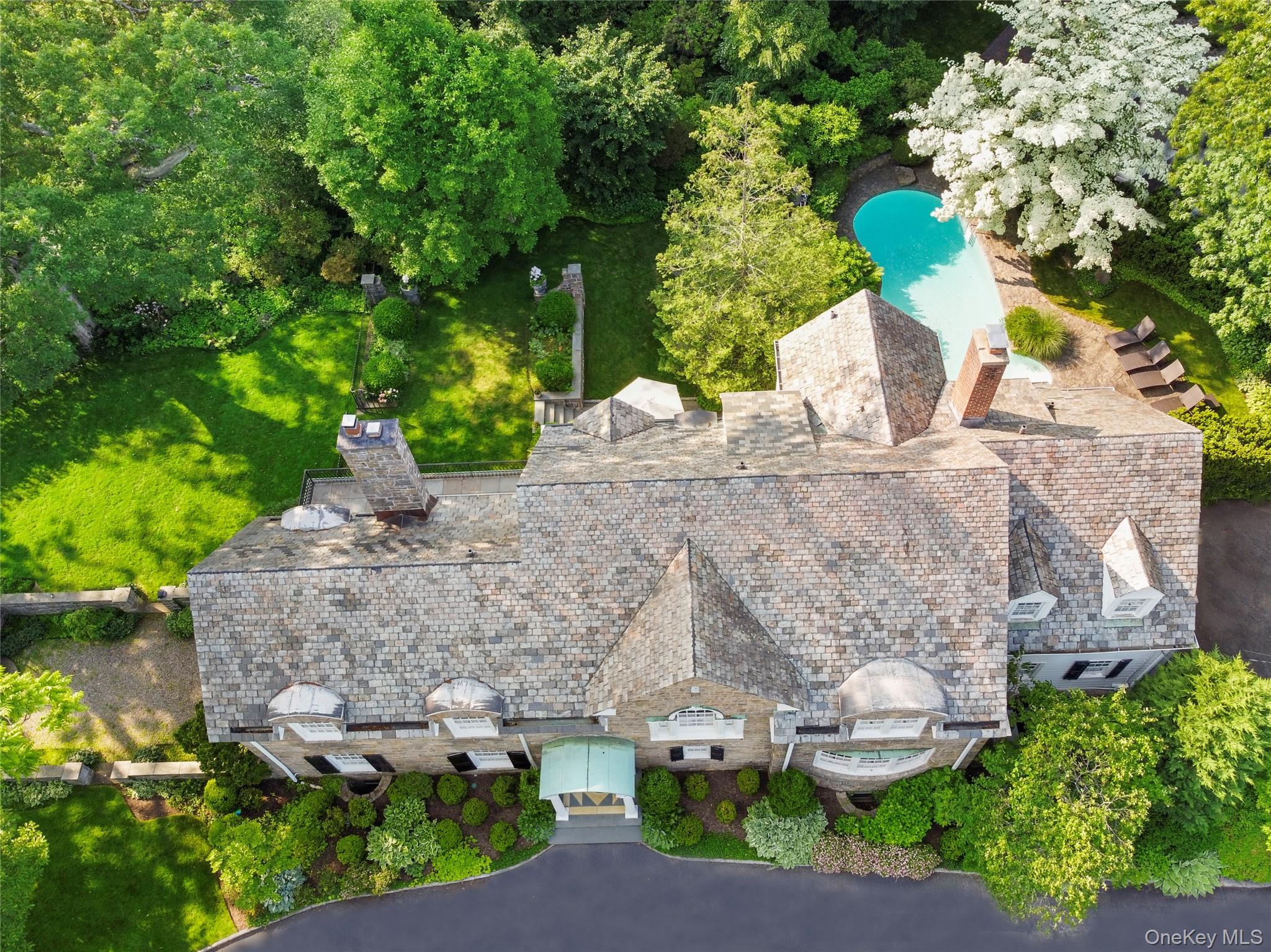 139 Hampshire Road Bronxville, NY 10708 - Photo 41 of 47 an aerial view of a house with a yard and garden