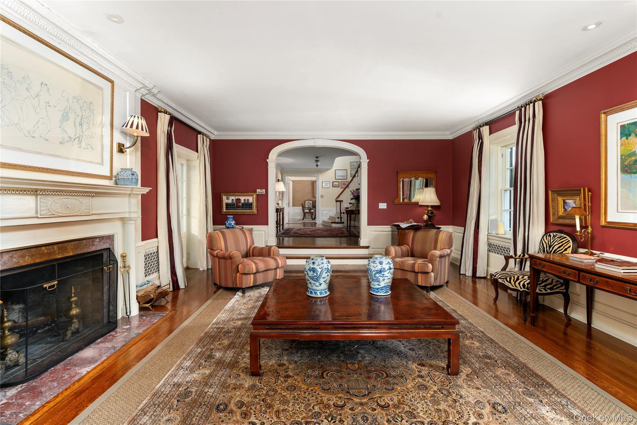 139 Hampshire Road Bronxville, NY 10708 - Photo 6 of 47 a living room with furniture a fireplace and a large window