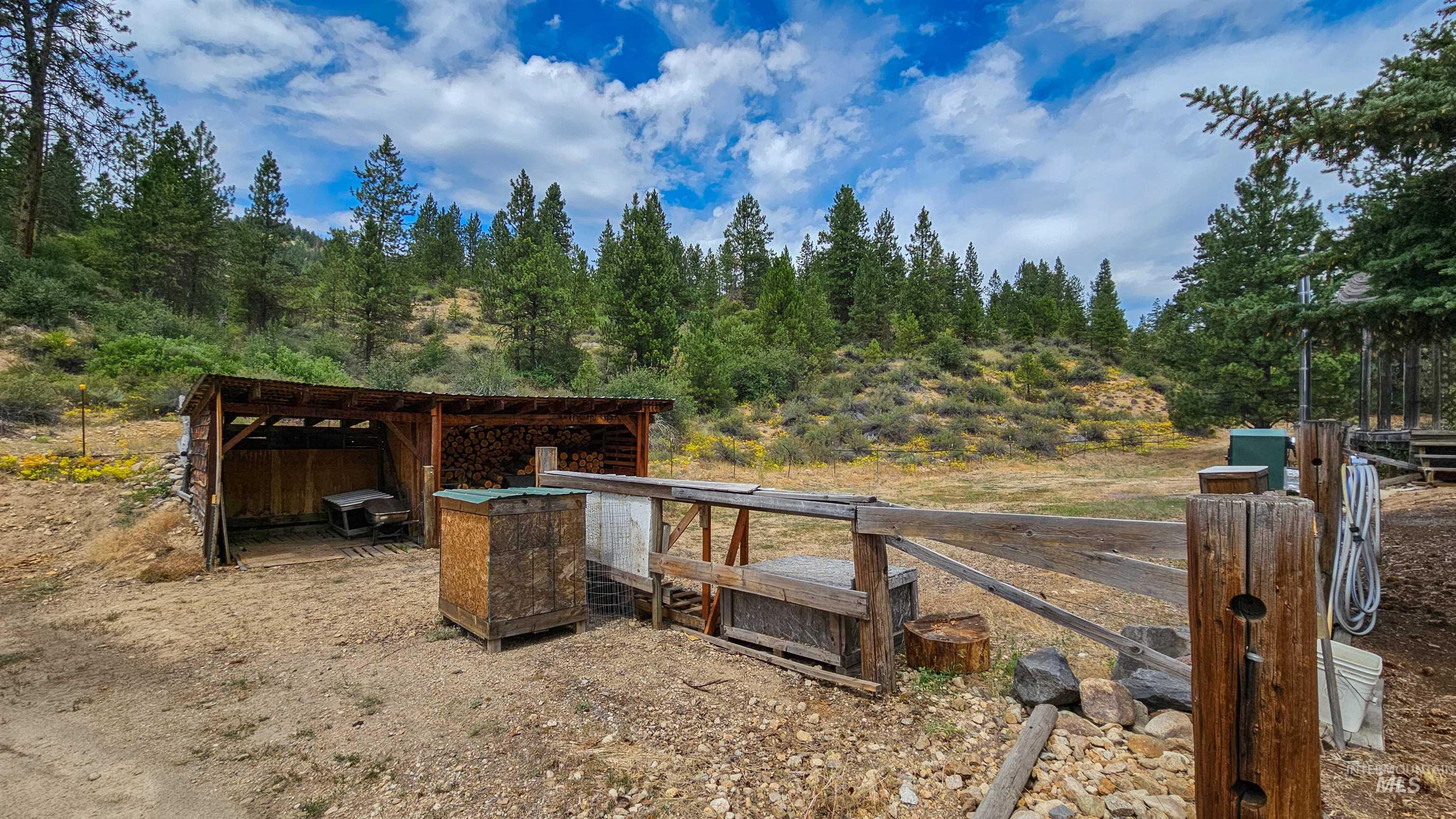 3382 Highway 21 Boise, ID 83716 - Photo 37 of 50 View of yard with a wooded view and an outdoor structure