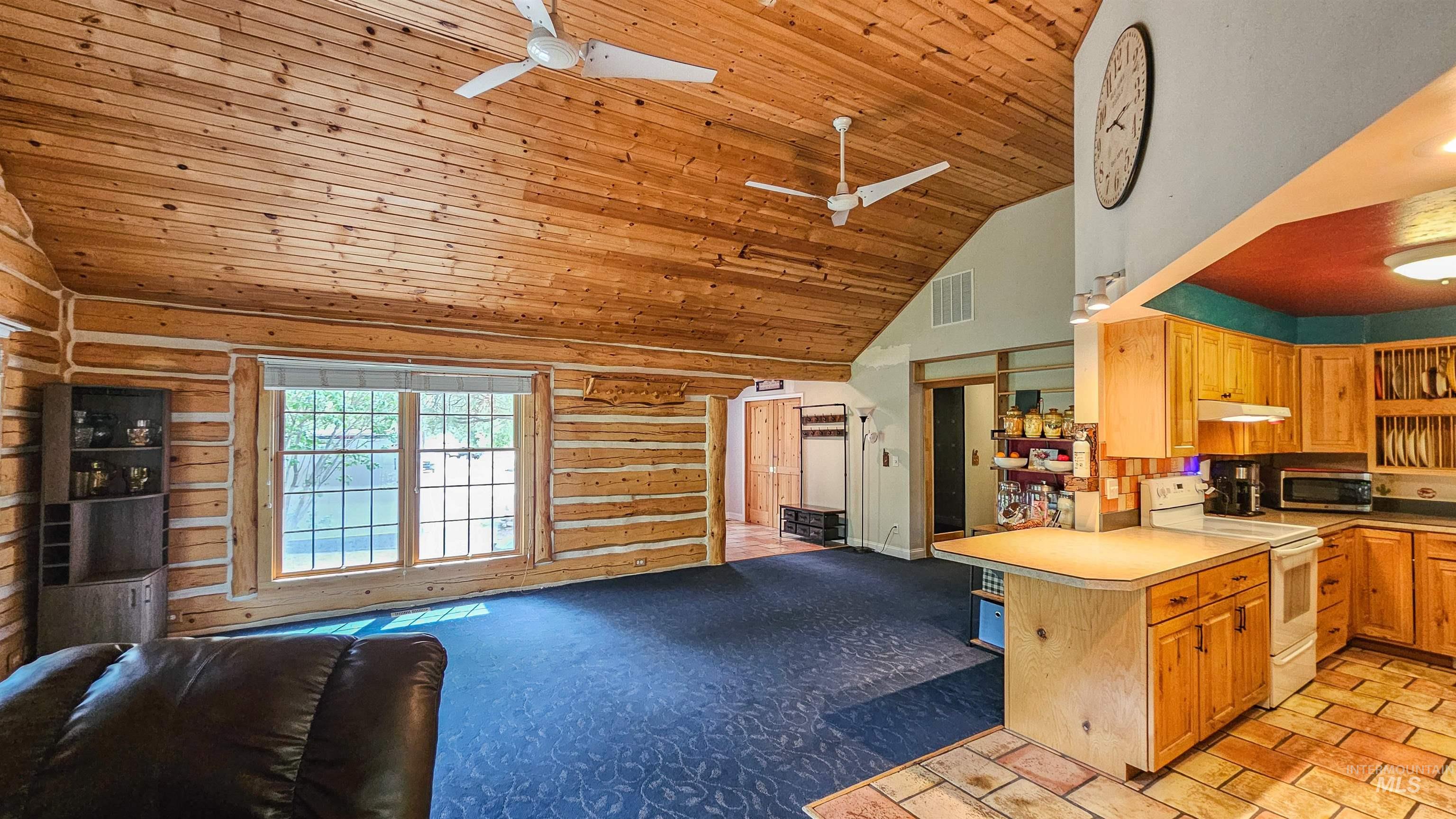 3382 Highway 21 Boise, ID 83716 - Photo 50 of 50 Kitchen featuring open floor plan, ceiling fan, white electric stove, high vaulted ceiling, and wooden ceiling