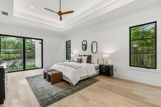 a bathroom with a double vanity sink and a mirror with shower
