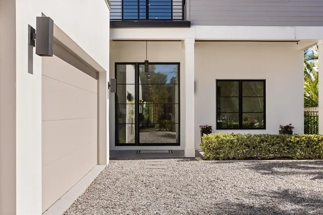 a front view of a house with a glass door