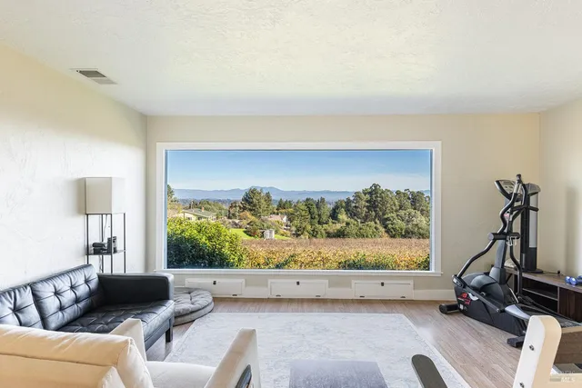 a view of a living room and window