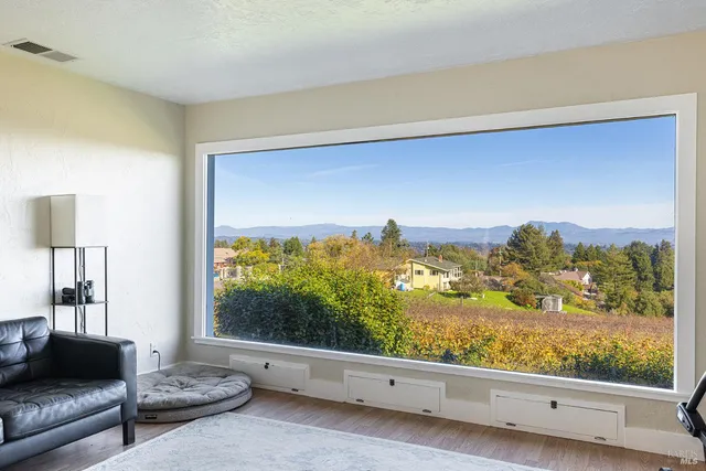 a view of a dining room with furniture window and outside view