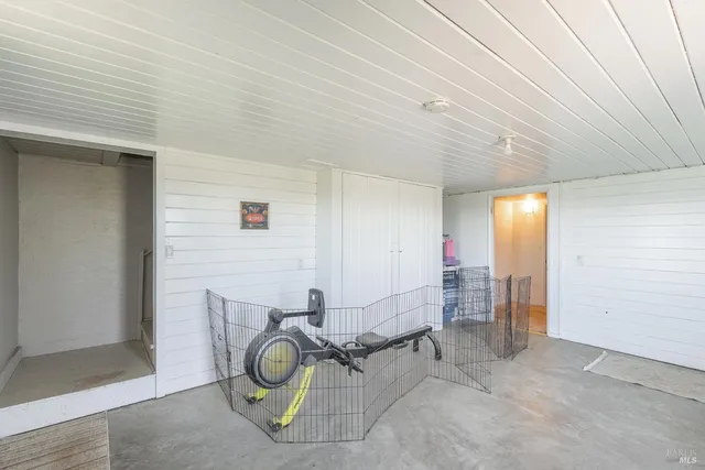 a view of a storage & utility room with a window