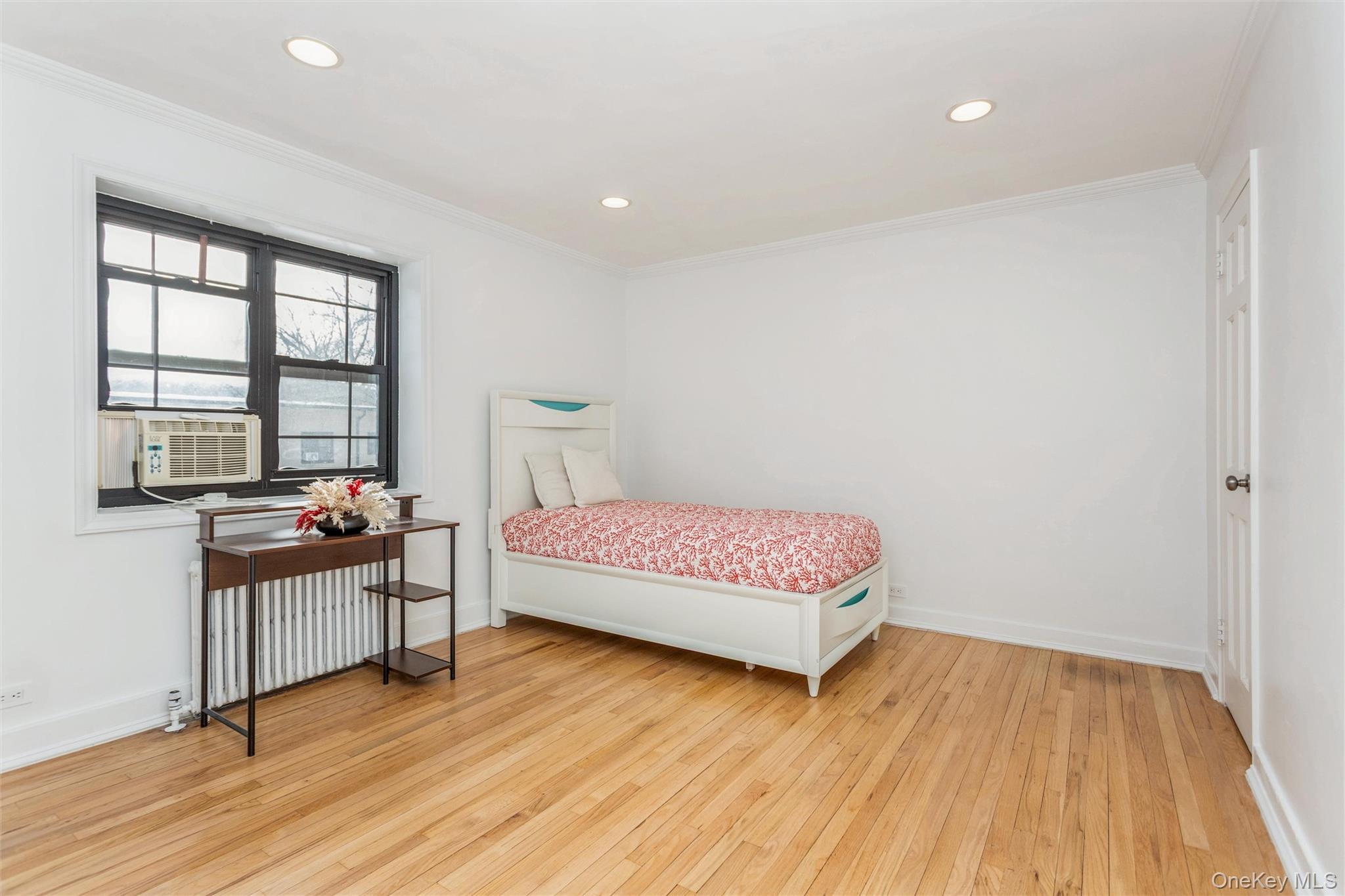 25 Manchester Road, Unit B23 Eastchester, NY 10709 - Photo 14 of 28 a bedroom with a bed and a table