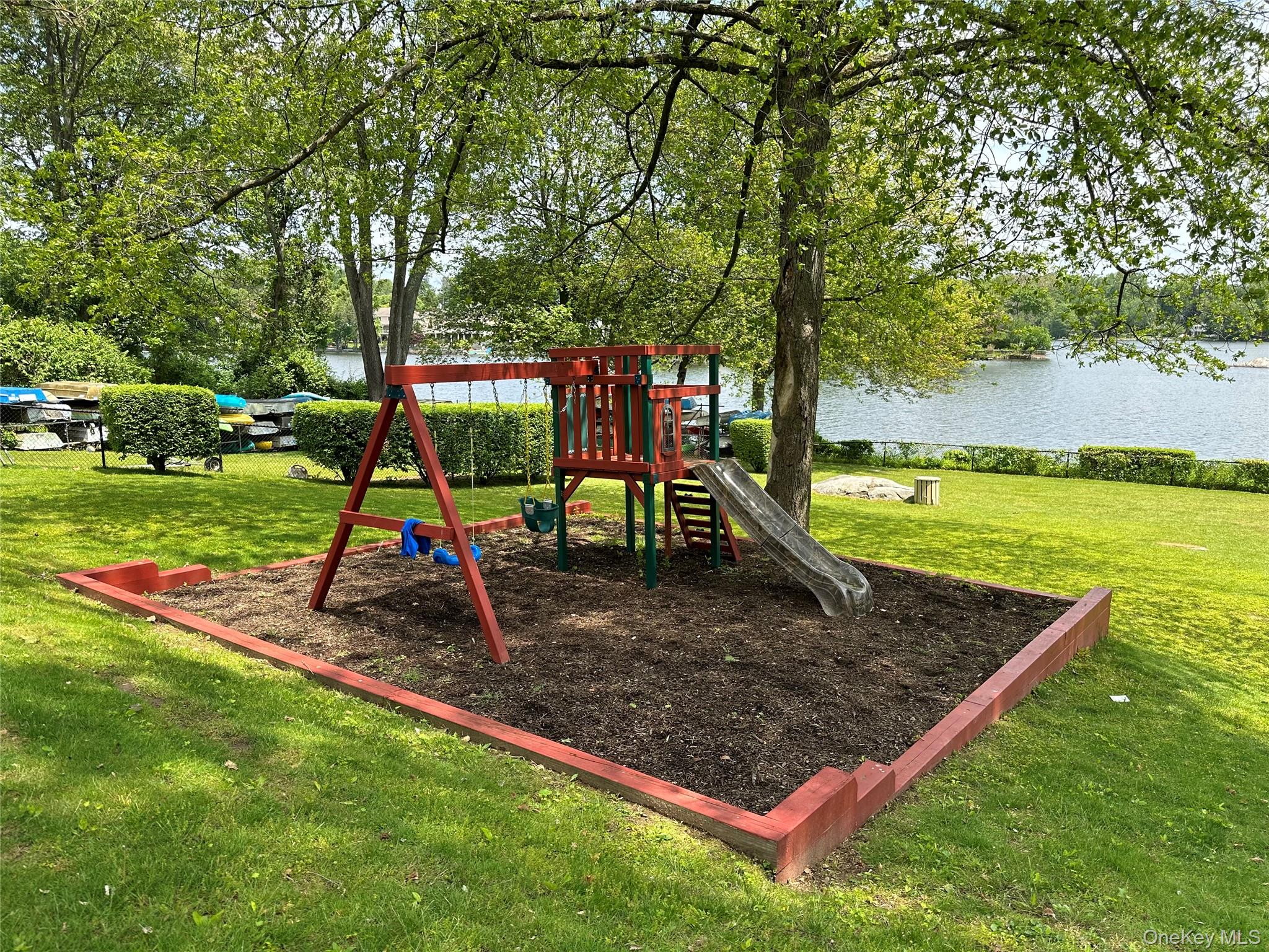 25 Manchester Road, Unit B23 Eastchester, NY 10709 - Photo 26 of 28 a view of a park with swings