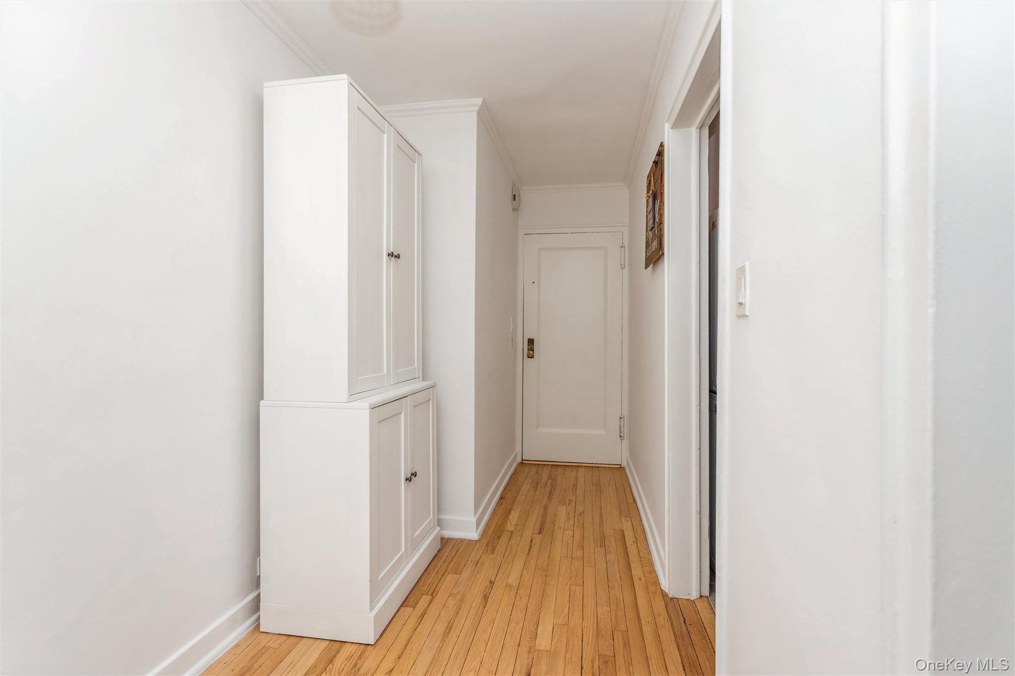 25 Manchester Road, Unit B23 Eastchester, NY 10709 - Photo 8 of 28 a view of a hallway with wooden floor