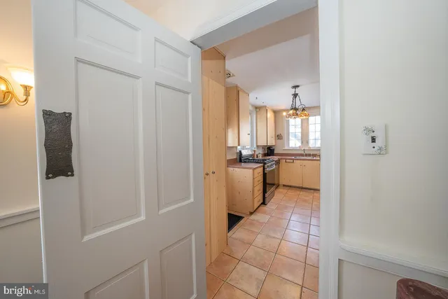 a living room with furniture cabinets and a book shelf