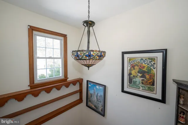 a view of a backyard with wooden fence