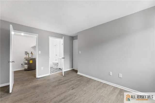 a view of an empty room and wooden floor