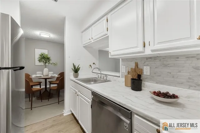 a kitchen with a sink and cabinets