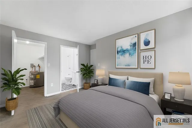 a bed room with a bed and a potted plant