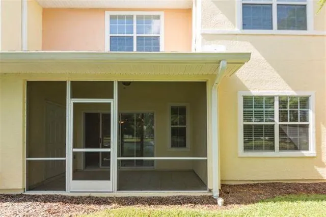 a view of a house with a door and a window