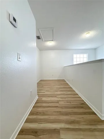 a view of an empty room with a window