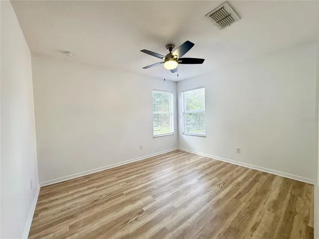 a bathroom with a toilet a sink a mirror and a bathtub