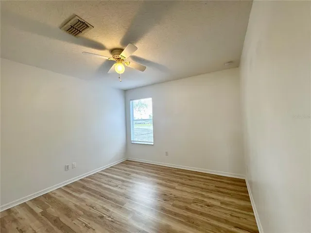 a bathroom with a toilet a sink a mirror and a bathtub
