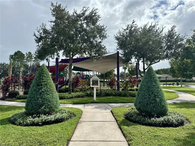 a front view of building with yard and green space