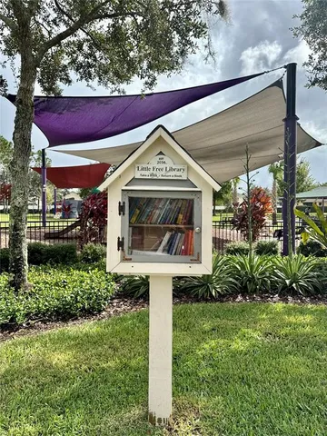 a view of a park with furniture