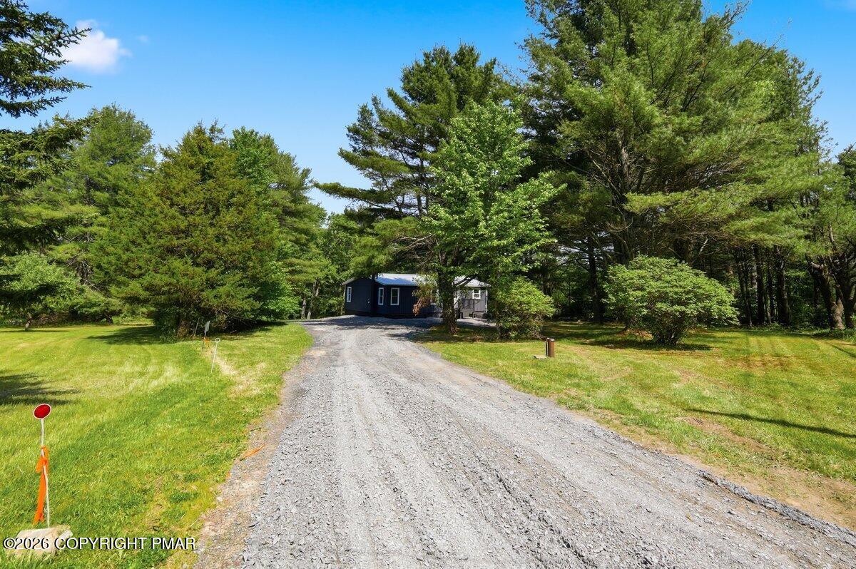 155 Blooming Grove Road Hawley, PA 18428 - Photo 6 of 41 a view of a swimming pool with a yard