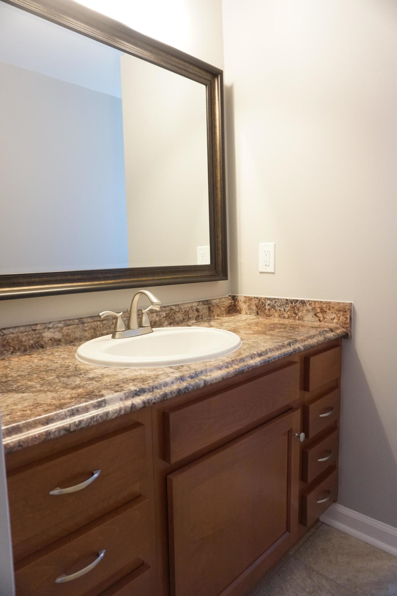 728 Olney Road Vinton, VA 24179 - Photo 14 of 37 a bathroom with a granite countertop sink and a mirror