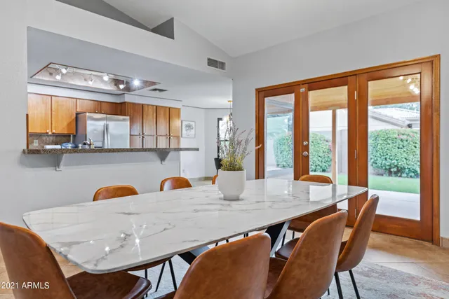 a view of a dining room with furniture window and outside view