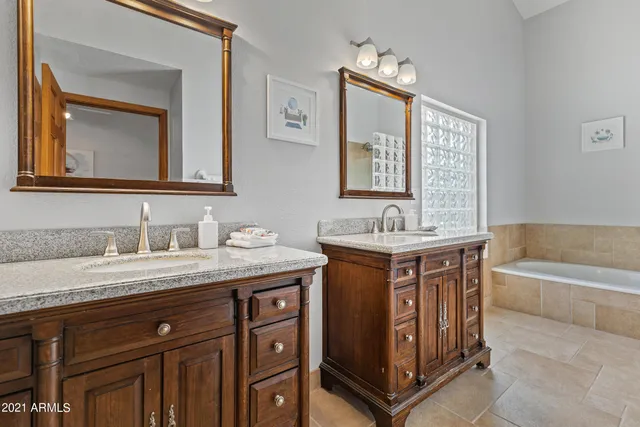 a bathroom with a bathtub and shower